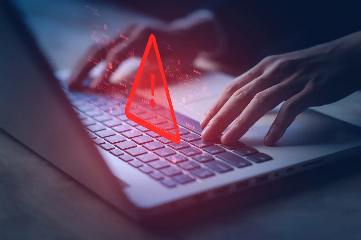 Keyboard with an alert symbol on the screen.