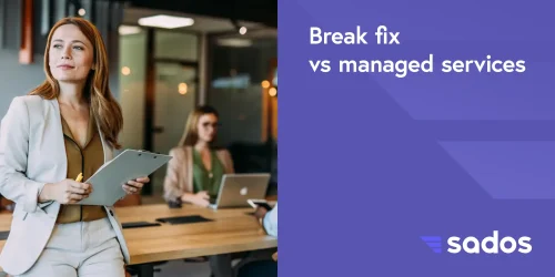Professional woman holding a clipboard in a meeting about break fix vs managed IT services at a modern office.